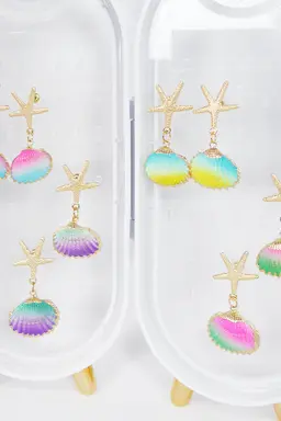 Aros estrella mar con ostra de Exotica Accesorios en Bijouterie para argentina