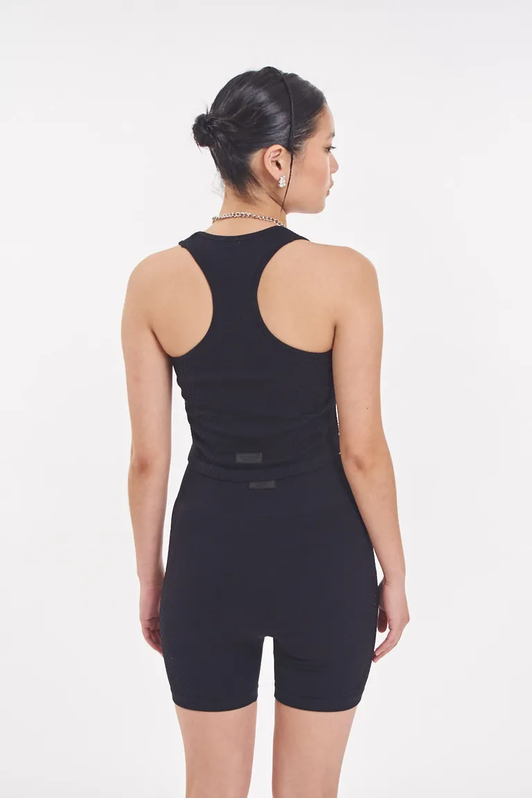 Top negro de diseño minimalista y textura diferenciada de 47 Street en Tops para argentina