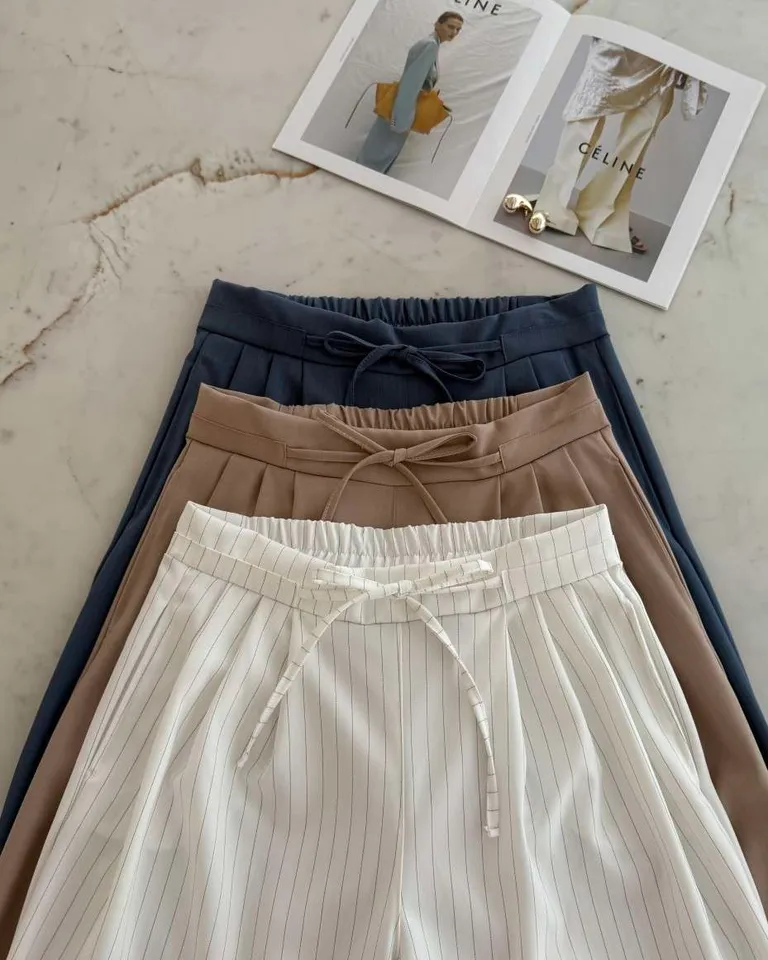 Pantalón ancho de corte recto con cintura elástica y lazos en tono beige de Hesed en Pantalones para argentina