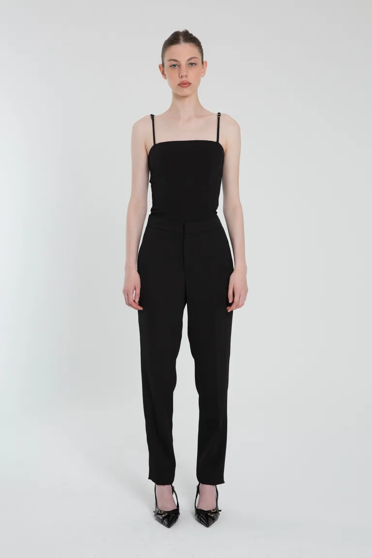 Pantalón de crepe negro con cierre y bolsillos laterales de Naíma en Pantalones para argentina