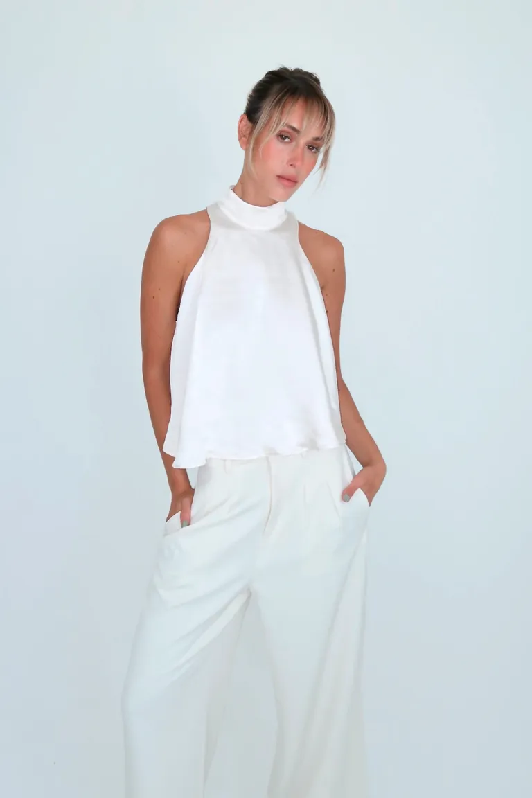 Top de cuello alto y escote halter en satén y crepe con botones metálicos en la espalda de Naíma en Tops para argentina