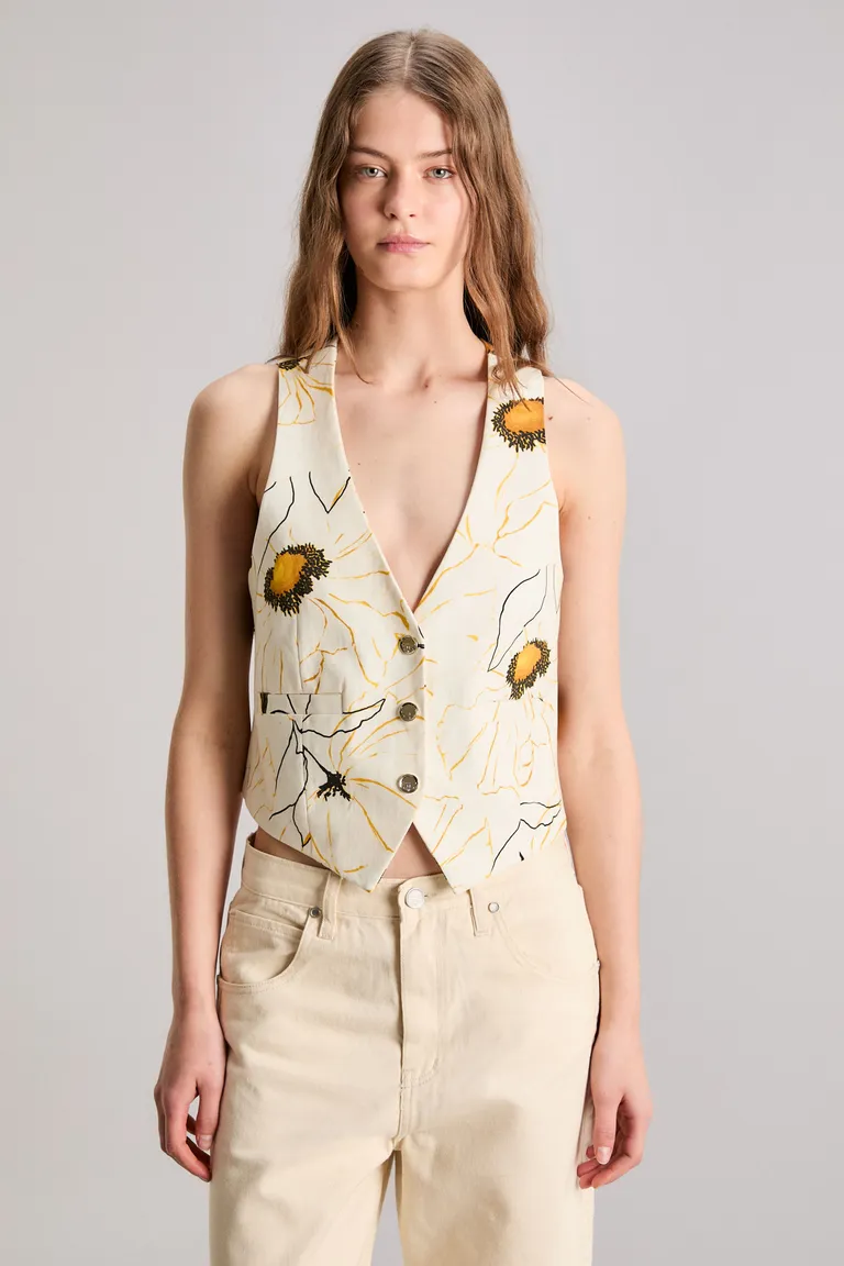 Chaleco sin mangas con estampado floral en tonos naturales para un look femenino y sofisticado de Kosiuko en Chalecos para argentina