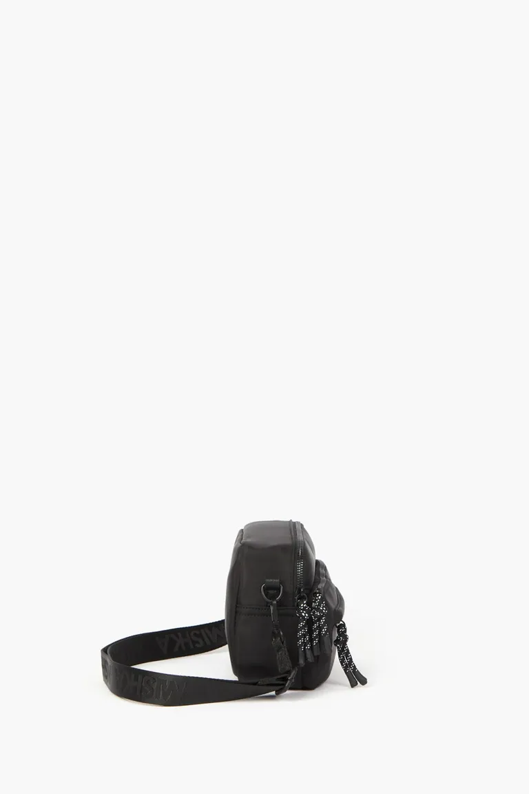 Bandolera rectangular tipo camera bag con bolsillo frontal y correa regulable con logo de Mishka en Bolsos y Carteras para argentina