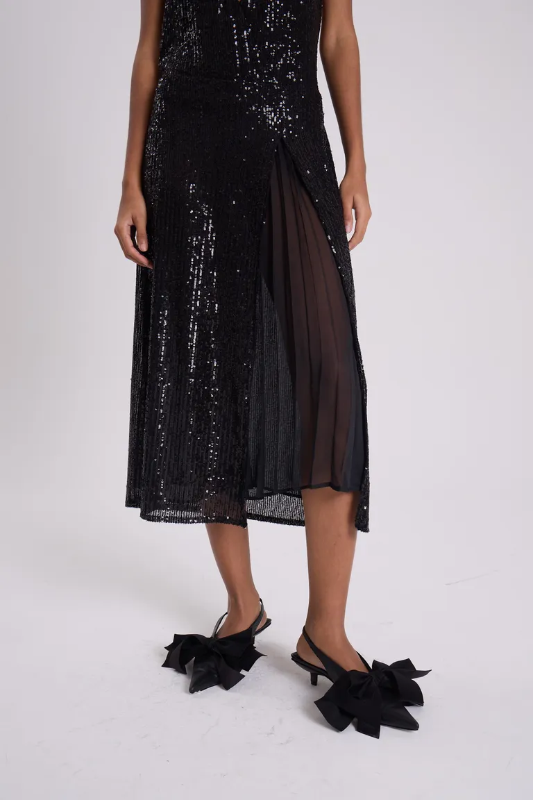 Elegante falda midi negra bordada en paillettes con tajo lateral y panel de gasa translúcida de Maria Cher en Faldas para argentina