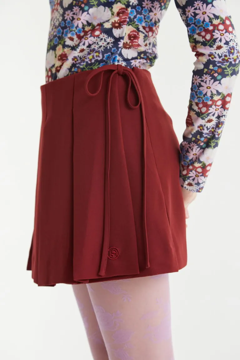 Falda sastrera corta acampanada con diseño tableado y lazo de ajuste lateral de Las Pepas en Faldas para argentina