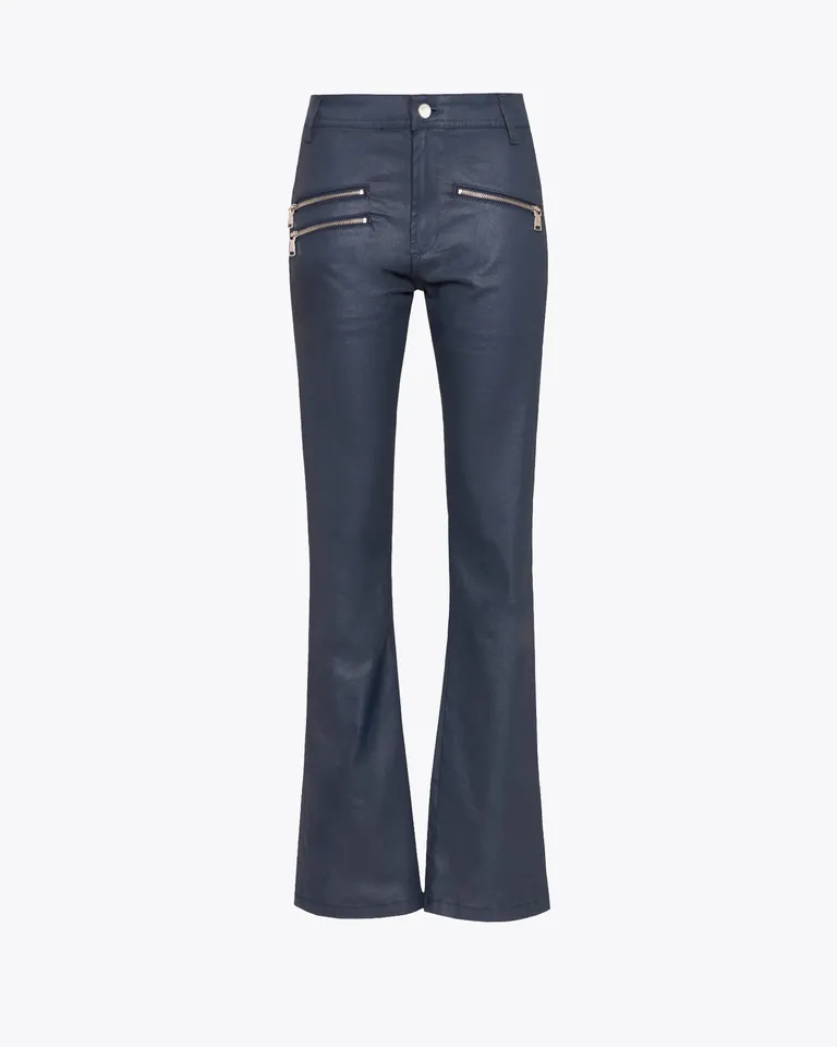 Jeans ajustados de tono azul petróleo con detalles metálicos de Jazmin Chebar en Pantalones para argentina