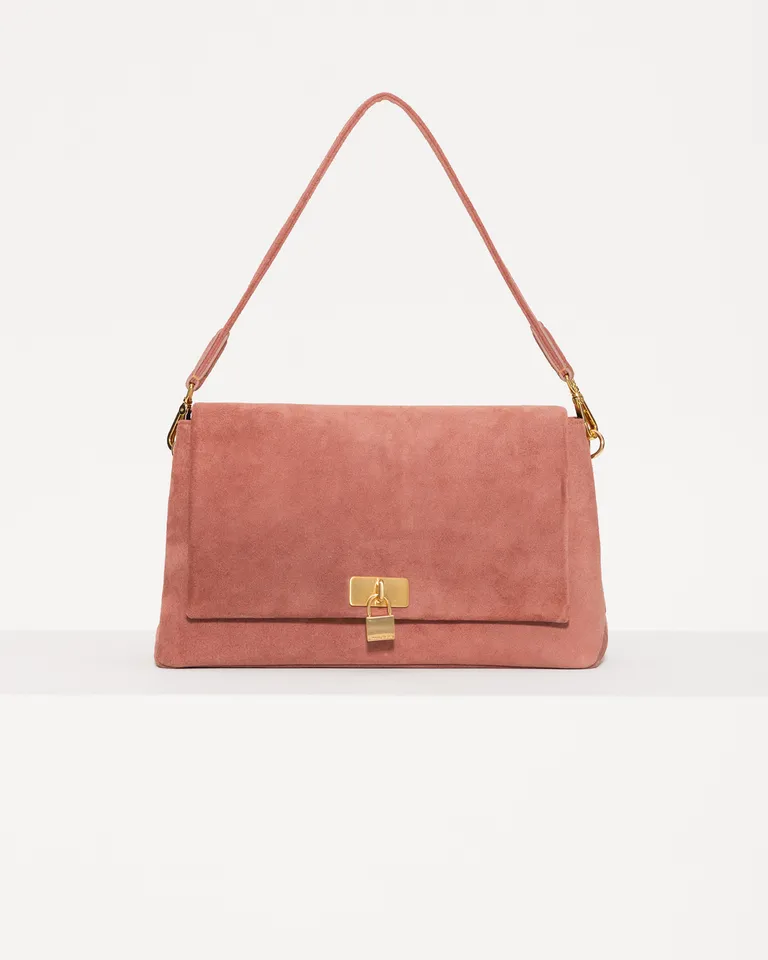 Cartera de cuero rosa con cierre lock y correa ajustable para llevar de diferentes maneras de Jazmin Chebar en Bolsos y Carteras para argentina