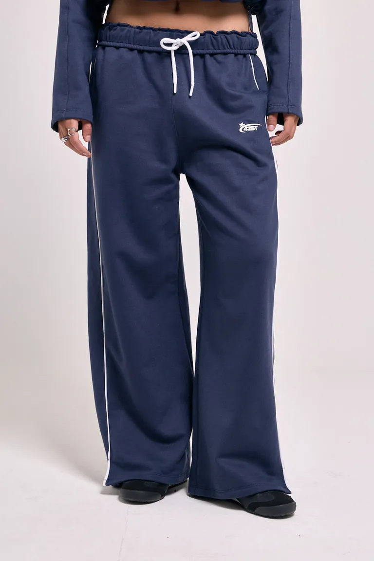 Pantalón deportivo de pierna ancha con cintura elástica, cordón ajustable y detalles de vivos laterales de 47 Street en Pantalones para argentina