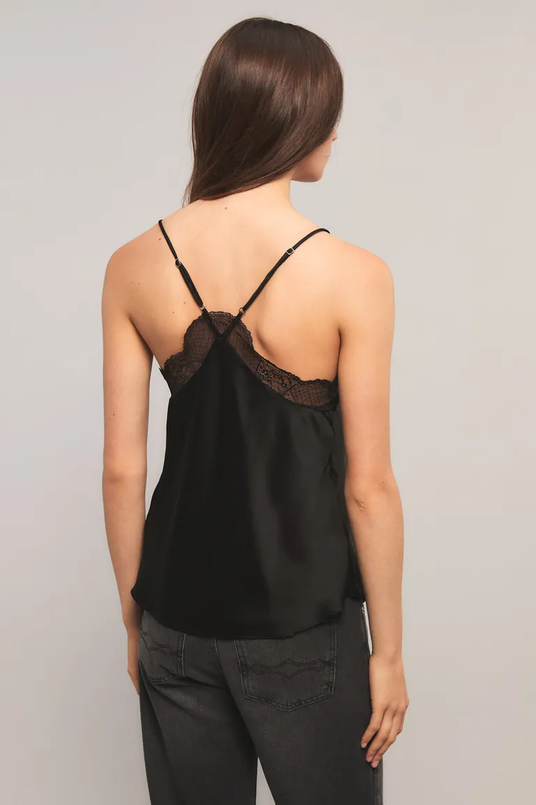 Top sin mangas con breteles regulables, escote en V y detalles de puntilla en bordes de Kosiuko en Tops para argentina